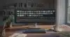 Wide view of a home office using AI video generation tools on a large monitor